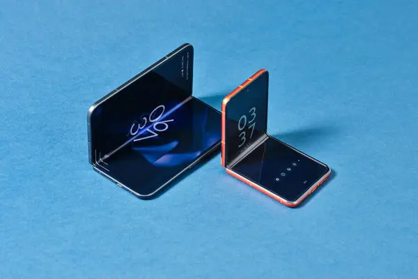 Future-of-Foldable-tech Foldable smartphones displayed on a blue background, showcasing modern foldable screen technology.
