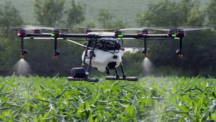 drone Agricultural drone spraying crops in a field using precision drone technology