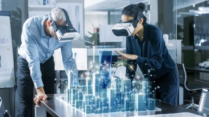 Digital-twin-technology—what-it-is-and-how-it-can-be-used-banner "Engineers using VR headsets to visualize a smart city digital twin simulation in a high-tech office"